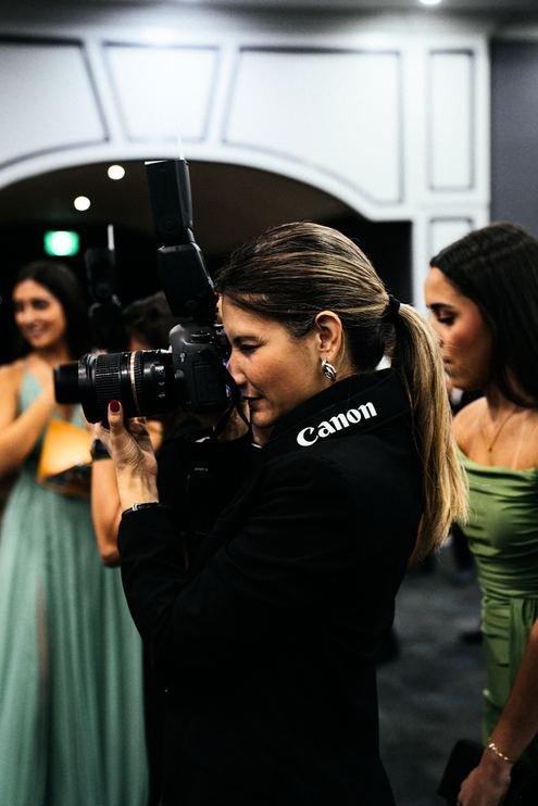 Camera operator filming at an event